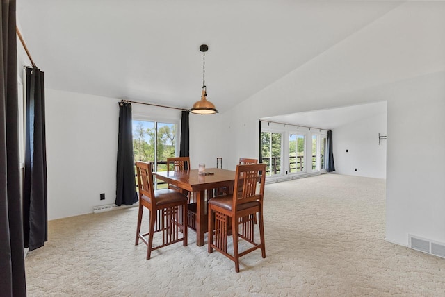 2373 State Road 33, Saukville, WI 53080 - dining space featuring light colored carpet, lofted ceiling, plenty of natural light, and a baseboard heating unit