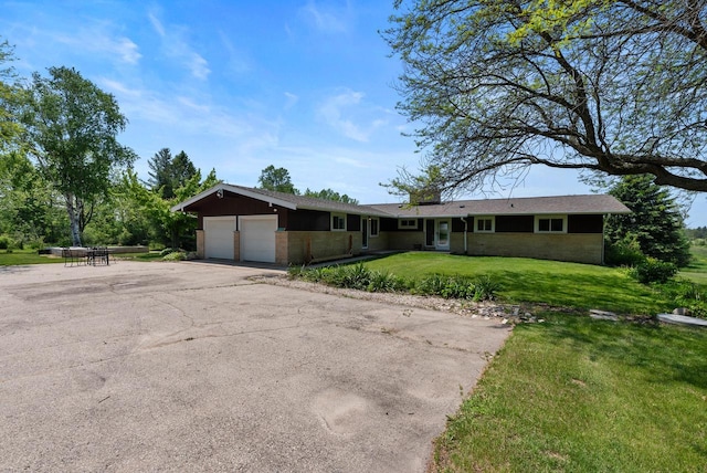 2373 State Road 33, Saukville, WI 53080 - ranch-style house featuring a garage, a front lawn, and asphalt driveway