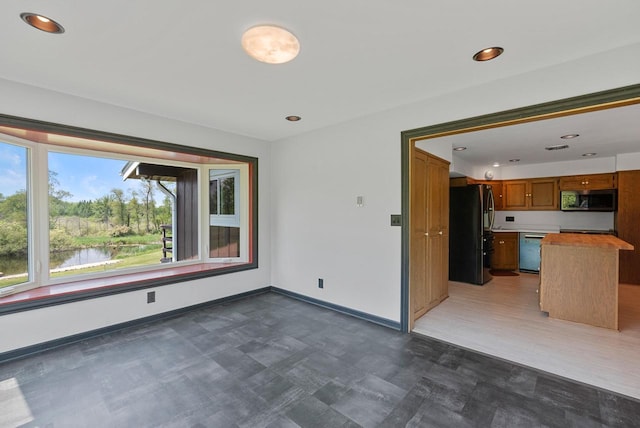 2373 State Road 33, Saukville, WI 53080 - unfurnished living room featuring baseboards, dark flooring, and recessed lighting