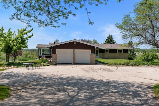 2373 State Road 33, Saukville, WI 53080 - single story home featuring a garage, a front lawn, and asphalt driveway
