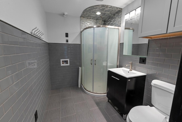 2373 State Road 33, Saukville, WI 53080 - full bath featuring tile walls, vanity, toilet, a shower stall, and tile patterned flooring