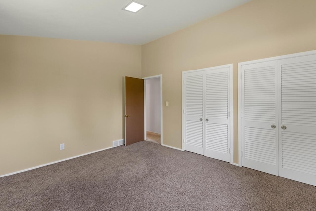 2373 State Road 33, Saukville, WI 53080 - unfurnished bedroom with carpet flooring, multiple closets, and baseboards