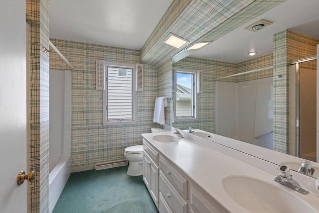 10109 N Gettysburg Ct, Mequon, WI 53092 - full bathroom featuring double vanity, washtub / shower combination, wallpapered walls, and baseboard heating