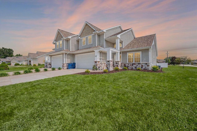 2527 W Crais Ct, De Pere, WI 54115 - craftsman-style home featuring a garage, concrete driveway, a yard, and stone siding