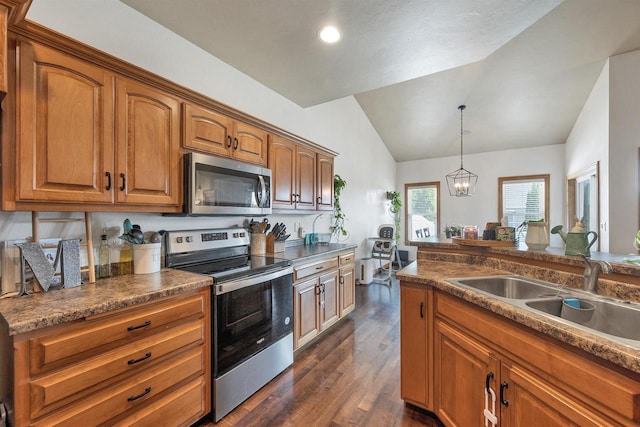 2527 W Crais Ct, De Pere, WI 54115 - kitchen featuring stainless steel appliances, lofted ceiling, a sink, dark wood-type flooring, and brown cabinets