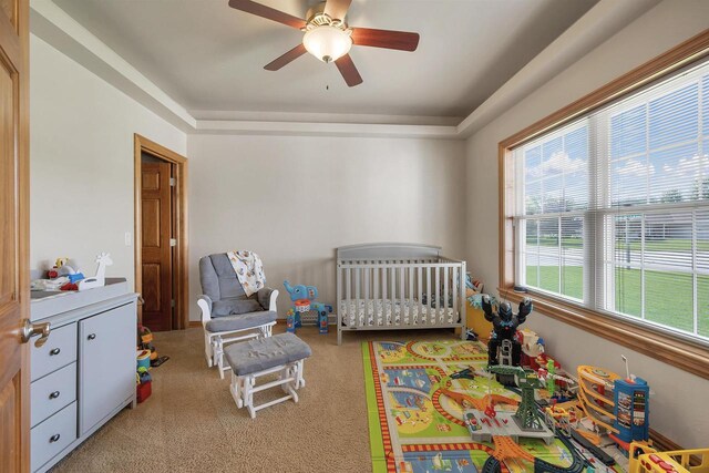 2527 W Crais Ct, De Pere, WI 54115 - carpeted bedroom with a nursery area and a ceiling fan
