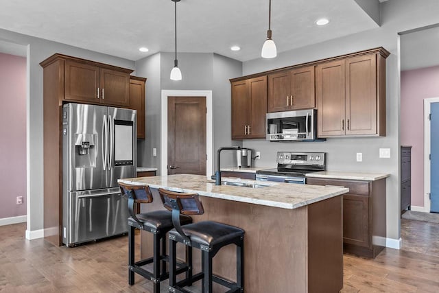 W5706 Mase Ct, Appleton, WI 54915 - kitchen featuring appliances with stainless steel finishes, baseboards, a sink, wood finished floors, and recessed lighting