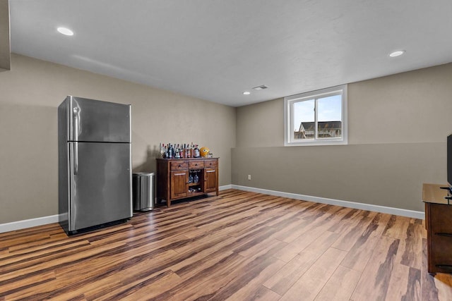 W5706 Mase Ct, Appleton, WI 54915 - kitchen featuring freestanding refrigerator, wood finished floors, baseboards, and recessed lighting