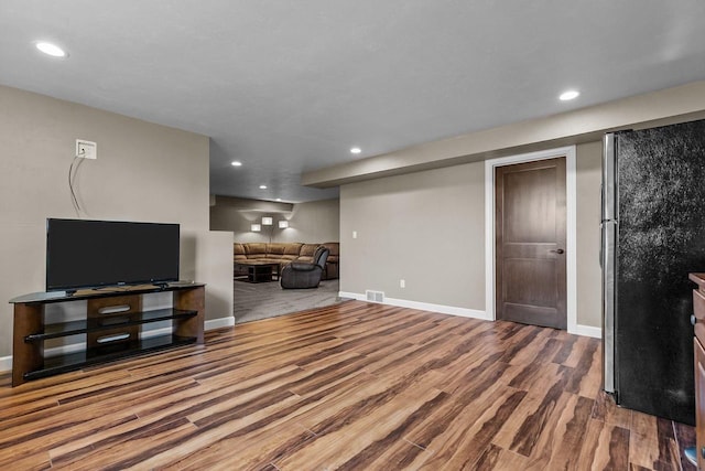 W5706 Mase Ct, Appleton, WI 54915 - unfurnished living room featuring wood finished floors, baseboards, and recessed lighting