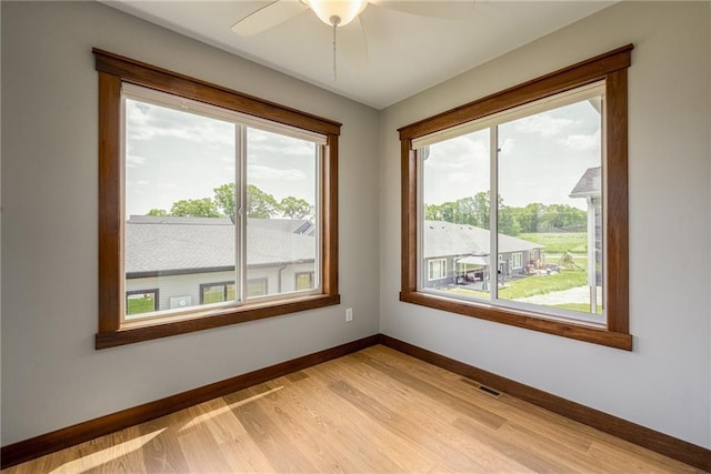 2837 Patrick John Dr, Eau Claire, WI 54703 - unfurnished room with healthy amount of natural light, baseboards, and ceiling fan