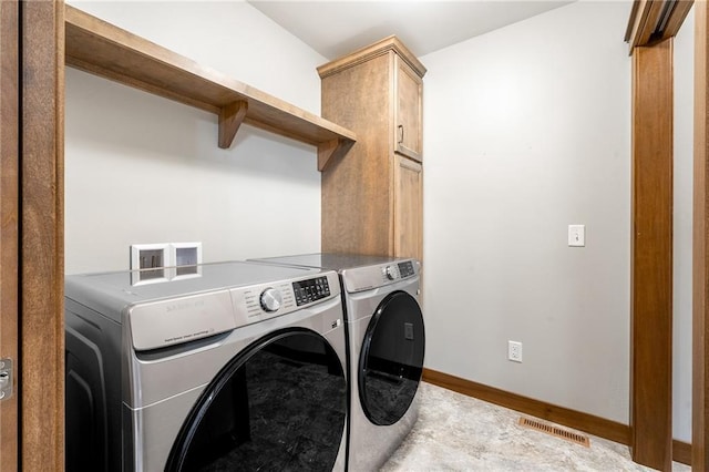 2837 Patrick John Dr, Eau Claire, WI 54703 - washroom featuring washer and clothes dryer, cabinet space, and baseboards