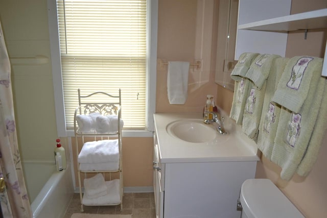 355 N Main St, Fond Du Lac, WI 54935 - bathroom featuring vanity, toilet, baseboards, and shower / bath combination with curtain