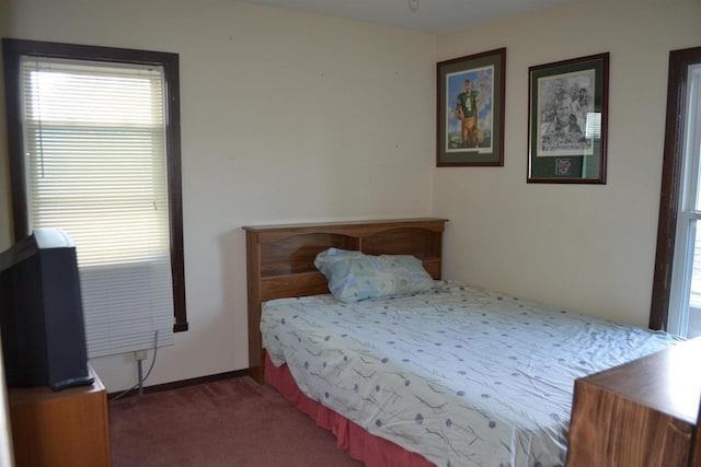 355 N Main St, Fond Du Lac, WI 54935 - carpeted bedroom featuring multiple windows and baseboards