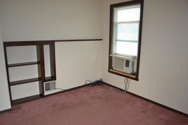 355 N Main St, Fond Du Lac, WI 54935 - empty room featuring carpet flooring, cooling unit, and baseboards