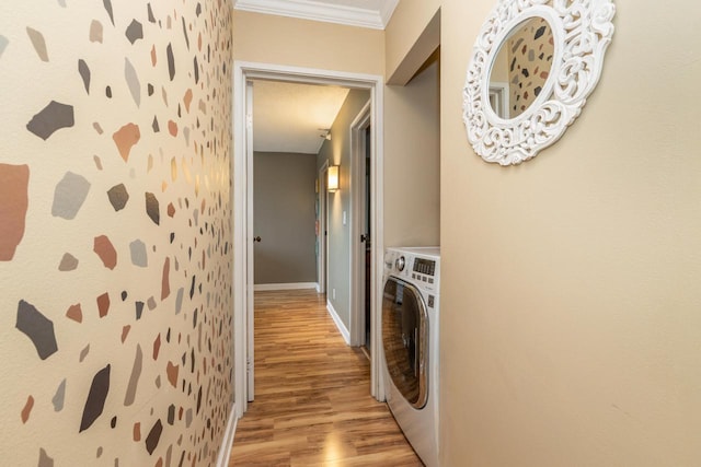 1660 N Prospect Ave Unit 611, Milwaukee, WI 53202 - washroom featuring washer / clothes dryer, light wood-style flooring, wallpapered walls, baseboards, and ornamental molding