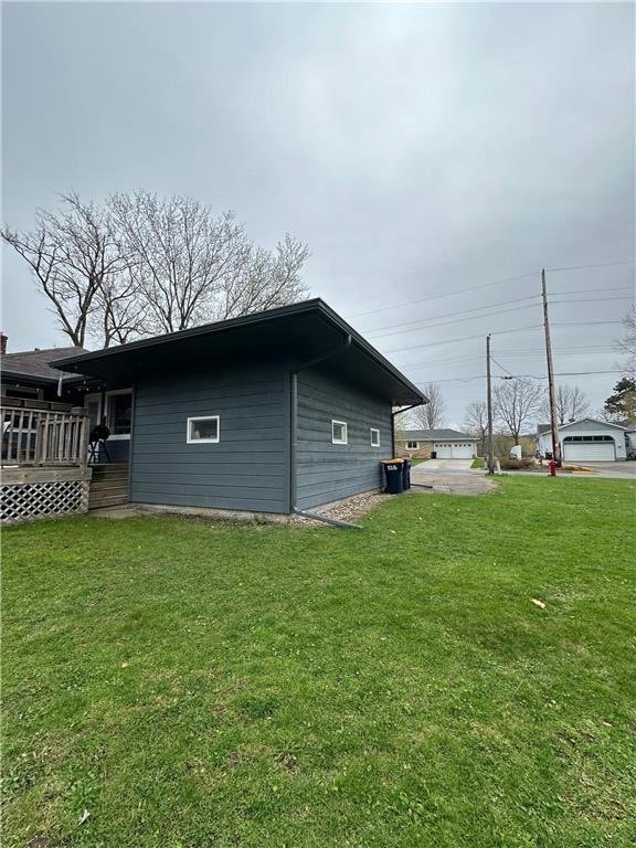 332 E Pleasant Ave, Ellsworth, WI 54011 - view of side of property featuring a deck and a yard