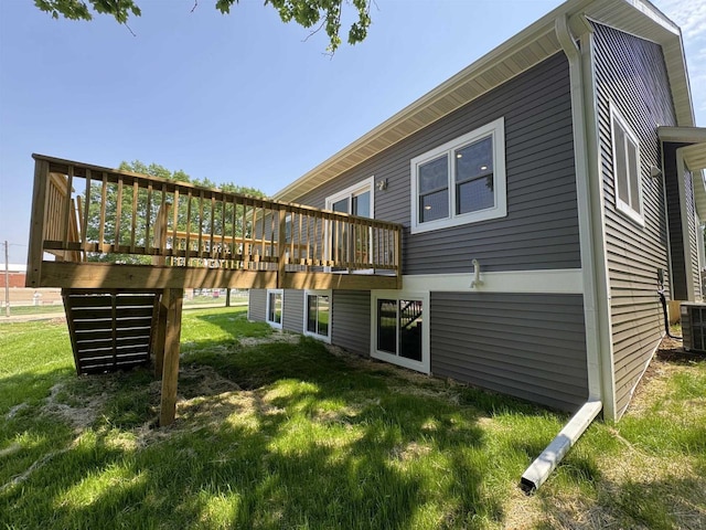 1511 16th Ave, Monroe, WI 53566 - back of house featuring a wooden deck and a lawn