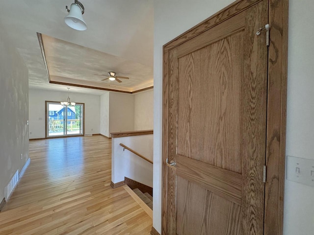 1511 16th Ave, Monroe, WI 53566 - hallway featuring an upstairs landing, light wood-style floors, baseboards, and a chandelier
