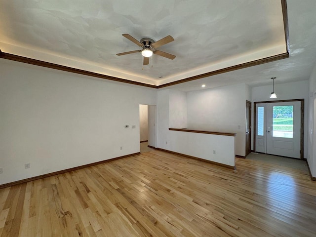 1511 16th Ave, Monroe, WI 53566 - empty room with a raised ceiling, ceiling fan, light wood-style flooring, baseboards, and recessed lighting