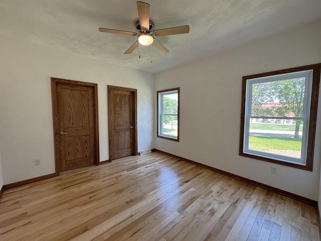 1511 16th Ave, Monroe, WI 53566 - spare room with light wood-style floors, baseboards, and a ceiling fan