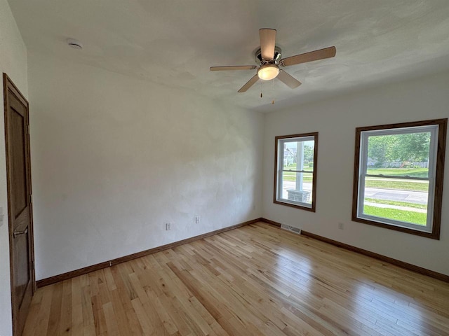 1511 16th Ave, Monroe, WI 53566 - spare room featuring light wood-type flooring, ceiling fan, baseboards, and a smoke detector