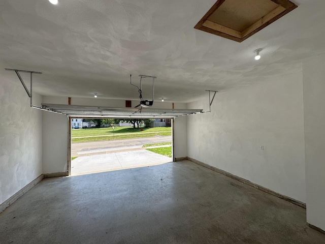 1511 16th Ave, Monroe, WI 53566 - garage with baseboards and a garage door opener