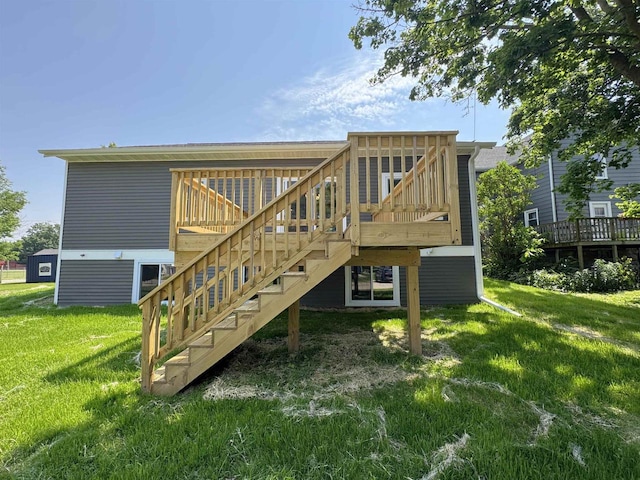 1511 16th Ave, Monroe, WI 53566 - rear view of property featuring a yard, a deck, and stairway