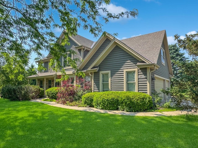 N49W31242 Old Steeple Rd, Hartland, WI 53029 - view of front facade featuring a front yard and a shingled roof