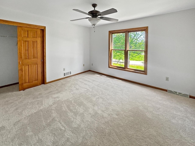 N49W31242 Old Steeple Rd, Hartland, WI 53029 - unfurnished room featuring a ceiling fan, baseboards, and carpet flooring