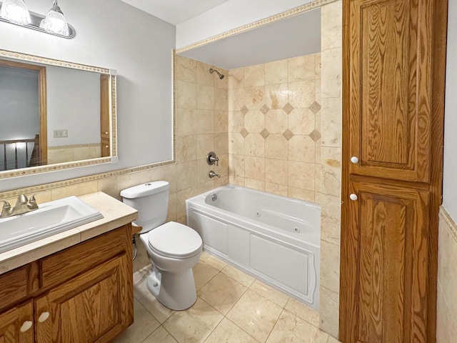 N49W31242 Old Steeple Rd, Hartland, WI 53029 - bathroom featuring tile walls, a combined bath / shower with jetted tub, vanity, toilet, and tile patterned flooring