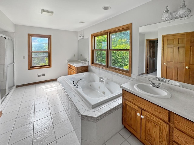 N49W31242 Old Steeple Rd, Hartland, WI 53029 - full bathroom featuring vanity, healthy amount of natural light, a tub with jets, and a stall shower