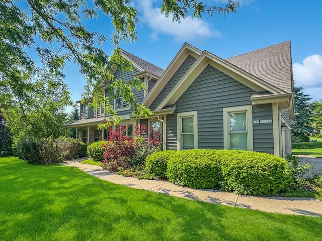 N49W31242 Old Steeple Rd, Hartland, WI 53029 - view of front of property featuring a front yard and roof with shingles