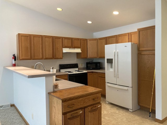 903 Rumley Run, Deforest, WI 53532 - kitchen with white fridge with ice dispenser, under cabinet range hood, electric range, black microwave, and a peninsula