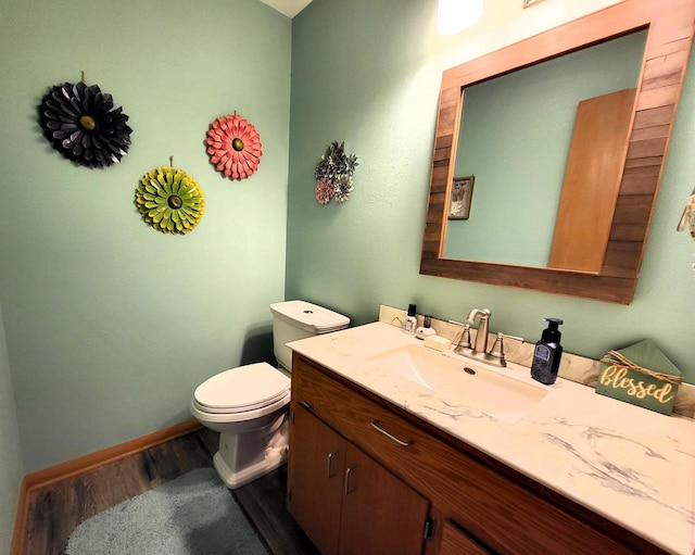 3843 S 95th St, Milwaukee, WI 53228 - half bathroom featuring wood finished floors, vanity, toilet, and baseboards