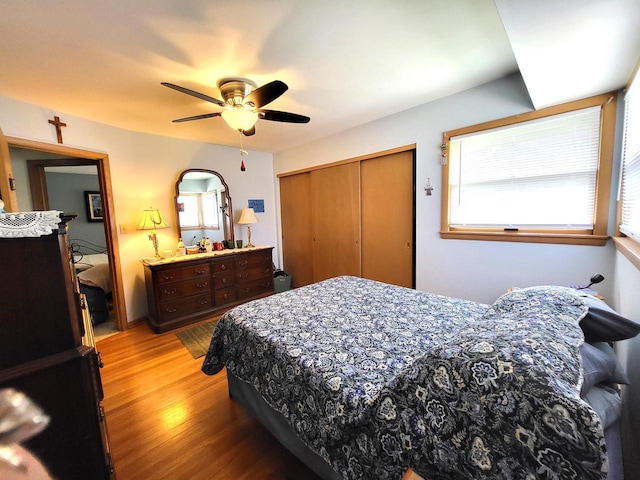 3843 S 95th St, Milwaukee, WI 53228 - bedroom featuring light wood-style flooring, a closet, and a ceiling fan