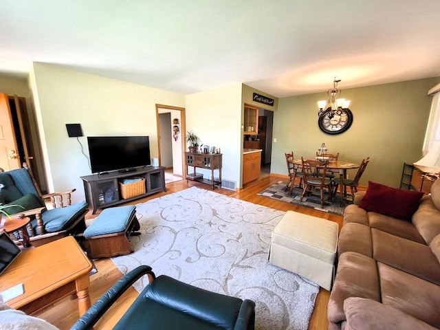 3843 S 95th St, Milwaukee, WI 53228 - living room with wood finished floors and a chandelier