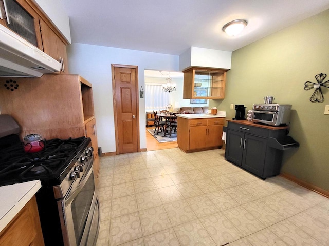 3843 S 95th St, Milwaukee, WI 53228 - kitchen with stainless steel range with gas stovetop, extractor fan, a chandelier, light countertops, and baseboards