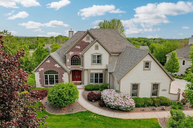 W226N3550 Wethersfield Rd, Pewaukee, WI 53072 - view of front facade with brick siding and a chimney