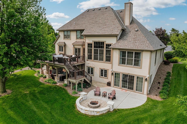W226N3550 Wethersfield Rd, Pewaukee, WI 53072 - back of property with a fire pit, a patio, stairs, a deck, and a yard