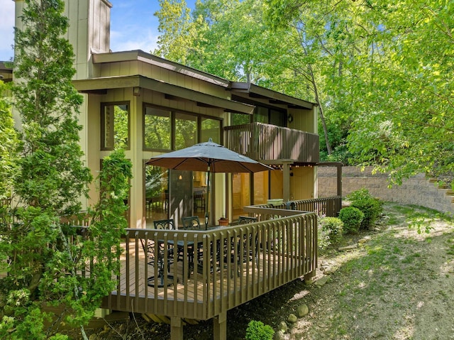 840 Woodland Ct Unit Ee-1, Fontana, WI 53125 - back of house with a wooden deck, outdoor dining space, and a balcony