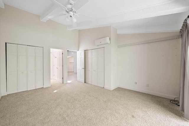 840 Woodland Ct Unit Ee-1, Fontana, WI 53125 - unfurnished bedroom featuring a wall mounted AC, carpet, multiple closets, beam ceiling, and baseboards