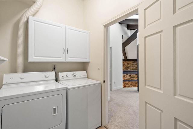 840 Woodland Ct Unit Ee-1, Fontana, WI 53125 - laundry area featuring cabinet space, independent washer and dryer, light colored carpet, and baseboards