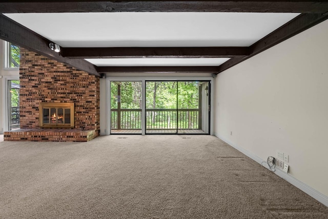 840 Woodland Ct Unit Ee-1, Fontana, WI 53125 - unfurnished living room featuring beamed ceiling, carpet floors, plenty of natural light, a fireplace, and baseboards