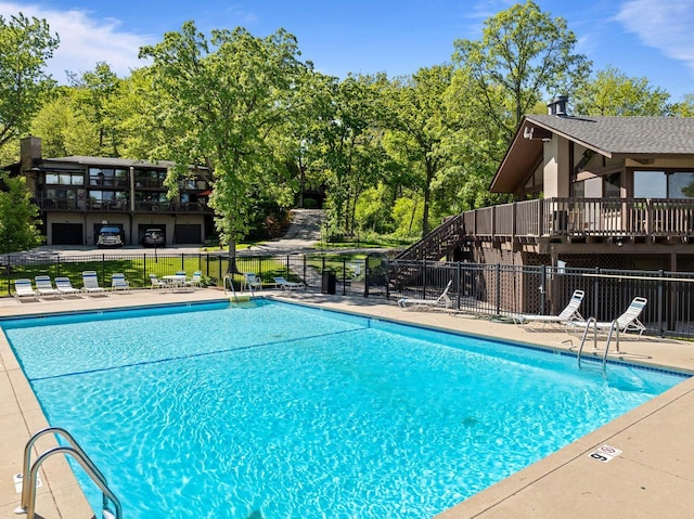 840 Woodland Ct Unit Ee-1, Fontana, WI 53125 - community pool featuring stairs, a patio, and view of wooded area