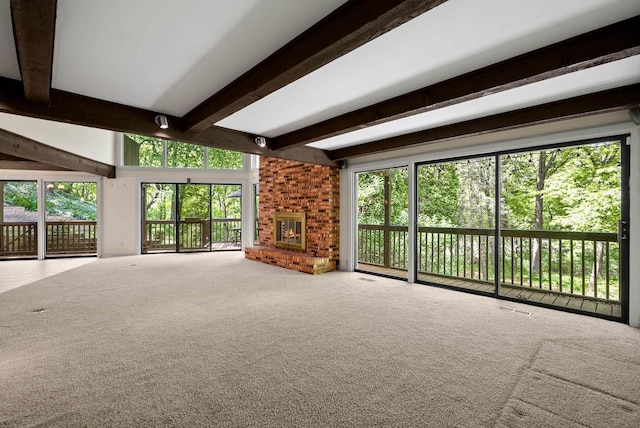 840 Woodland Ct Unit Ee-1, Fontana, WI 53125 - unfurnished living room with beam ceiling, carpet flooring, and a brick fireplace