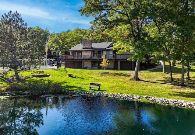 840 Woodland Ct Unit Ee-1, Fontana, WI 53125 - back of house with a chimney, a yard, and a deck with water view