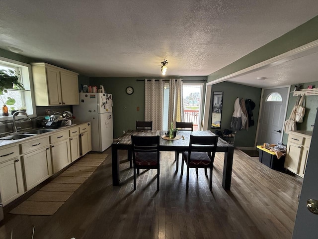2143 Clark St, Mount Pleasant, WI 53403 - dining area with plenty of natural light, a textured ceiling, and dark wood-type flooring