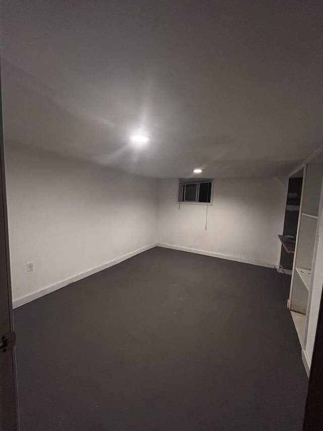 2143 Clark St, Mount Pleasant, WI 53403 - finished basement featuring recessed lighting, dark colored carpet, and baseboards