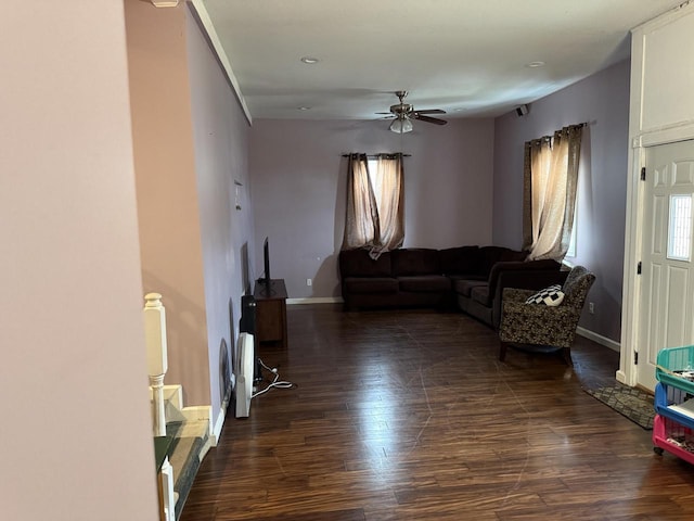 2143 Clark St, Mount Pleasant, WI 53403 - living area with dark wood finished floors, baseboards, and ceiling fan