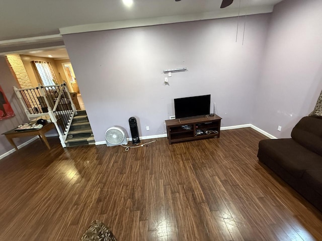 2143 Clark St, Mount Pleasant, WI 53403 - living room featuring wood finished floors, a ceiling fan, stairs, and baseboards